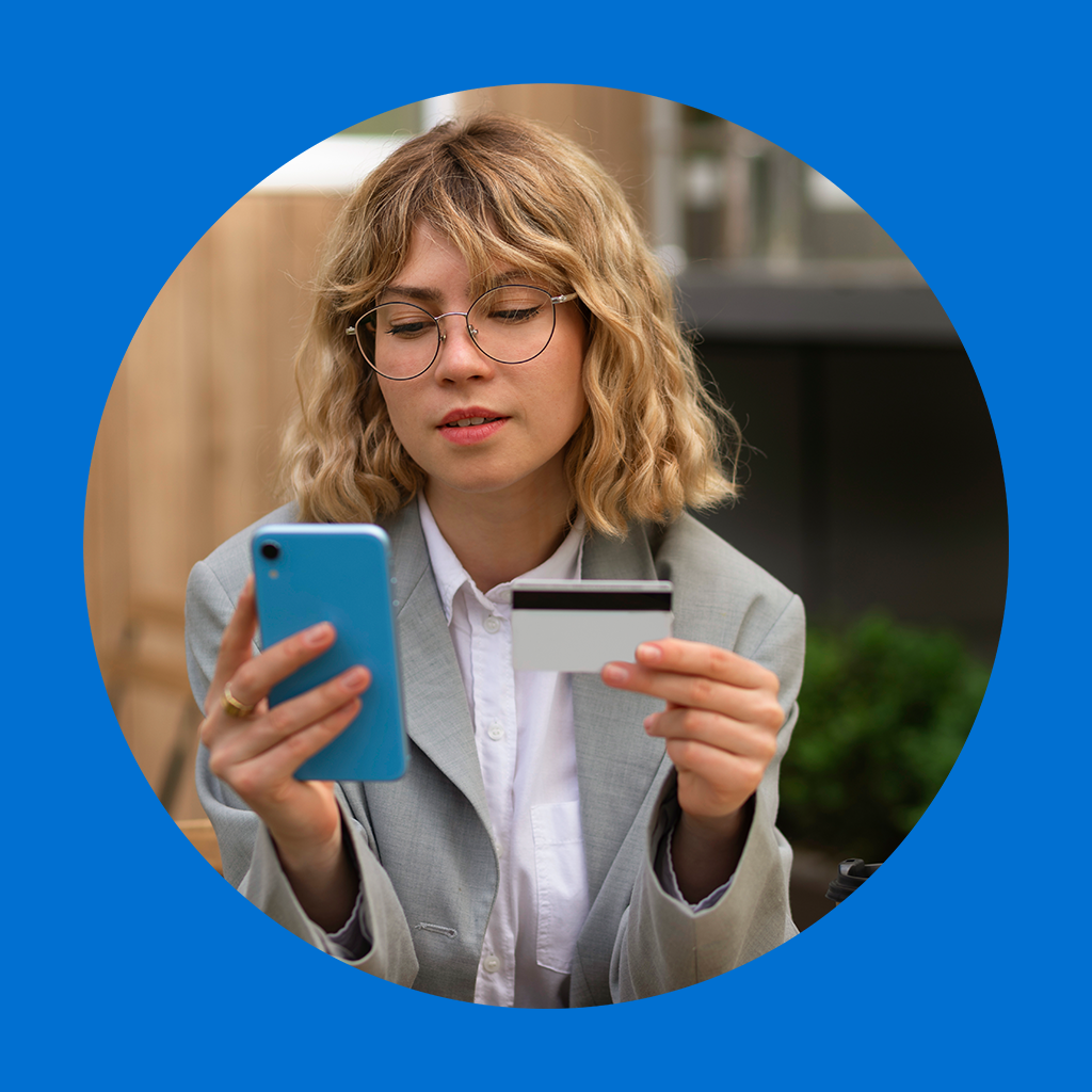 Hand holding $500 cash with quick loan application form