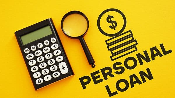 Personal loan text with calculator, magnifier and dollar sign