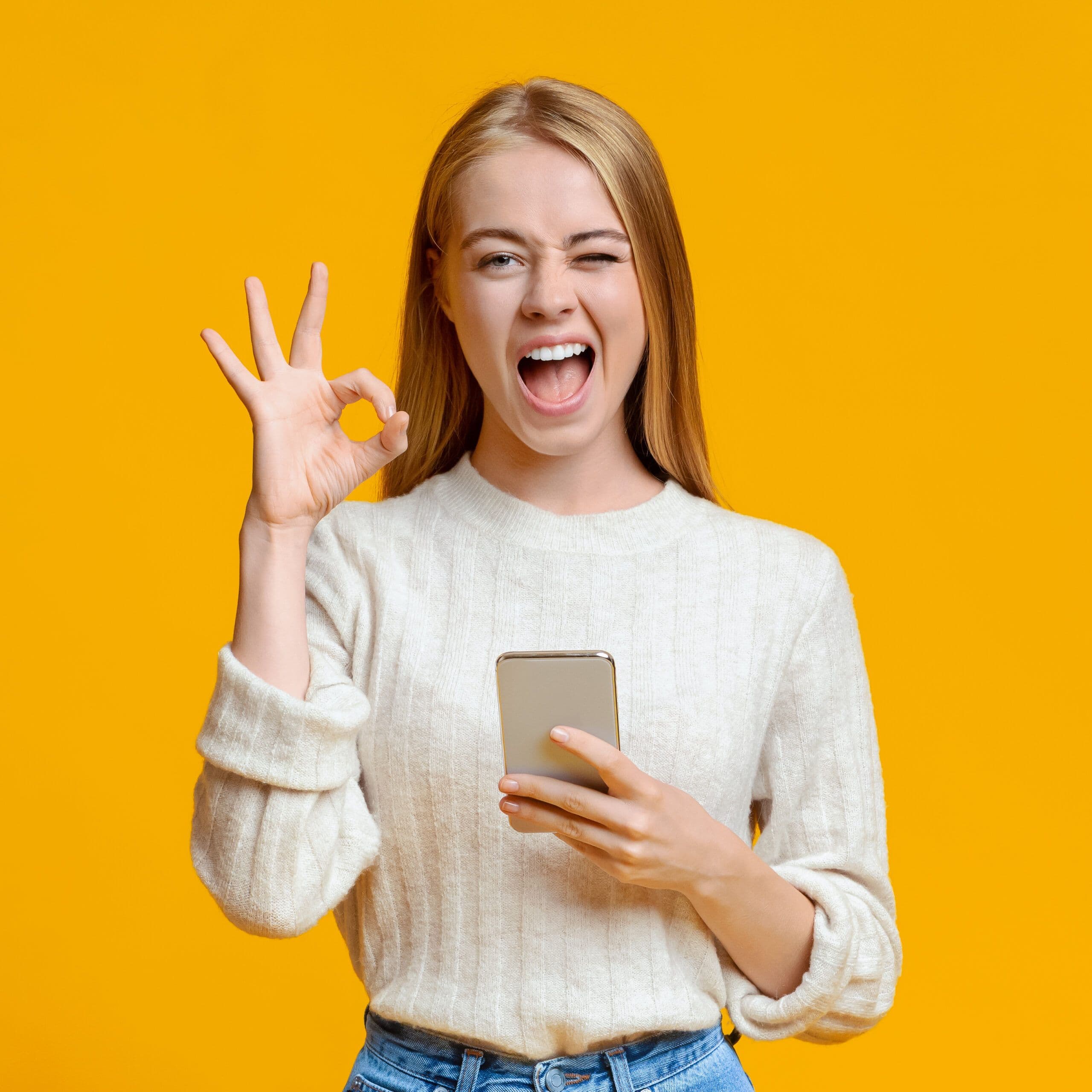 Lady holding phone winking