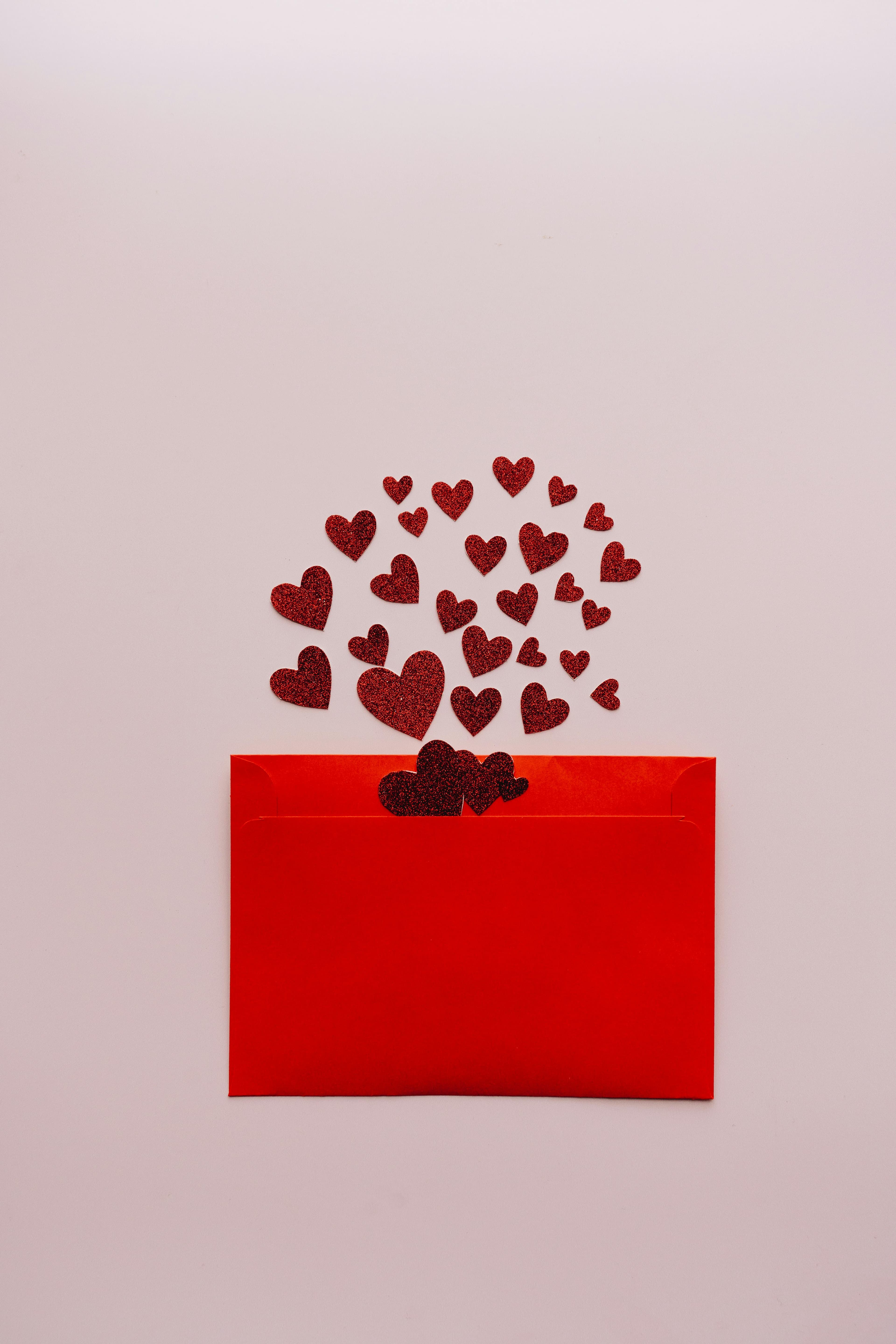 Envelope with hearts pouring out