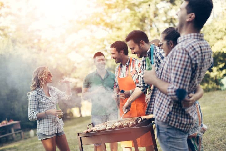 Group of people around a barbeque