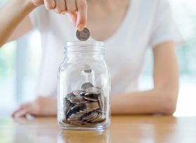 Putting money in Coin Jar