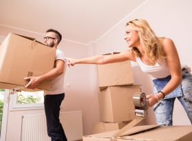 Couple Moving boxes home
