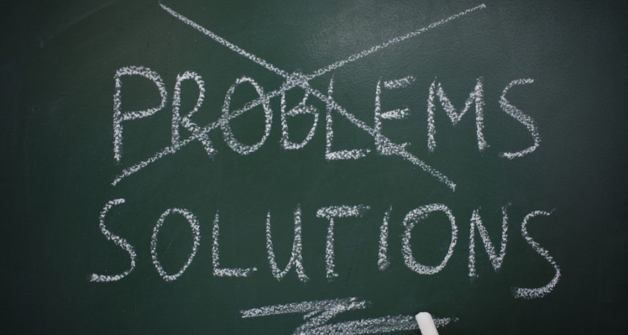 Problem cross out with solutions written on chalk board