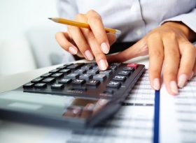 Woman calculating her finances