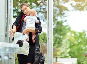 Mum carrying baby and bags