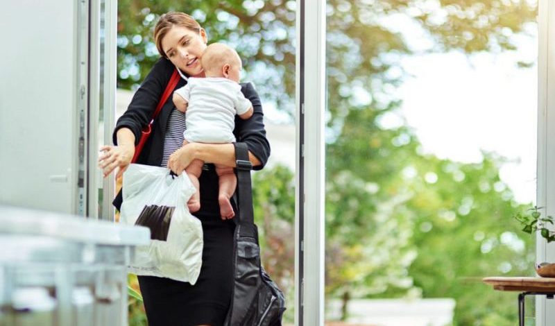 Mum carrying baby and bags