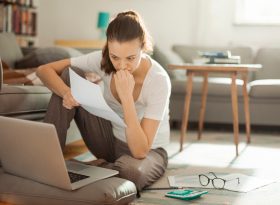 Young woman on her computer at home