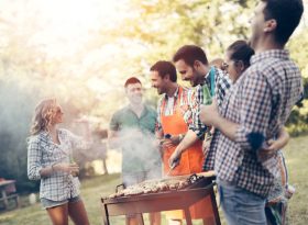 Friends barbequing outside