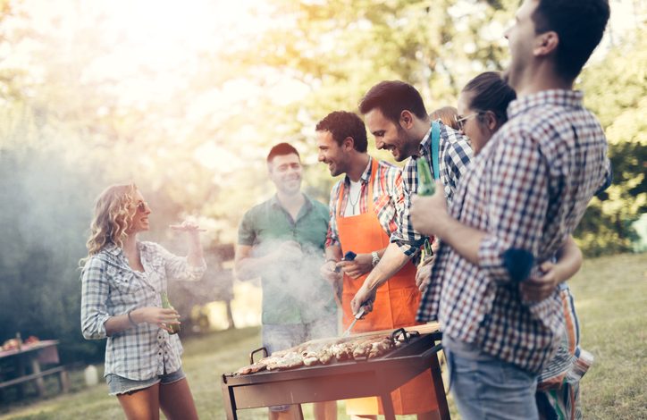 Friends barbequing outside