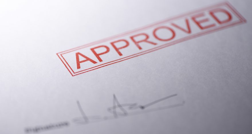 Close-up of blank contract form with approved stamped | Credit24 Approved Stamp