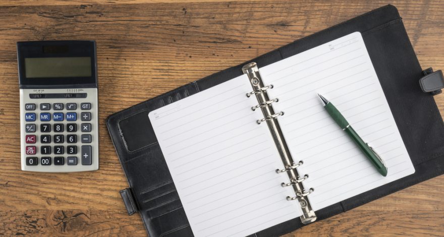 Organiser and calculator on table