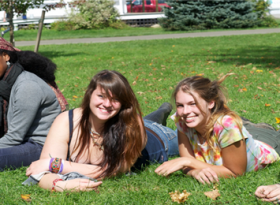 A group of student lying down on grass