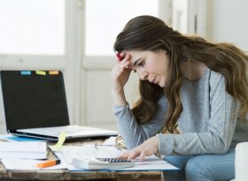 Woman is stressed with expenses