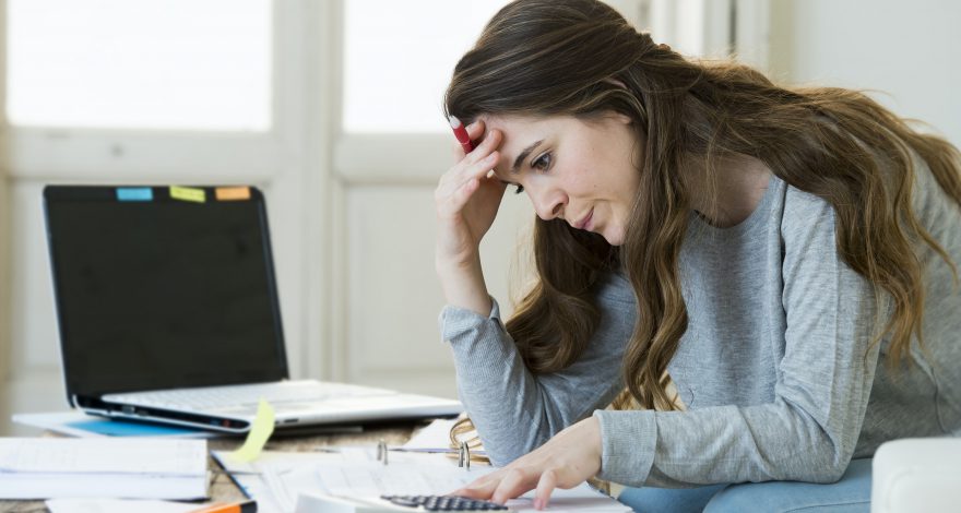 Woman is stressed with expenses